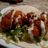 Buffalo Cauliflower Tacos · Vegan. Three soft flour tortillas, crispy cauliflower, and buffalo sauce with 