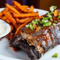 Full Rack Coffee Braised Baby Back Ribs · Chile and coffee-rubbed ribs, fall off the bone tender, house special BBQ sauce, cilantro sl...