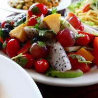 Tomato Mango Salad · This popular salad comes with mango, cherry tomatoes, strawberries, green apple, red onion, ...