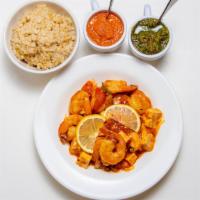 Shrimp Tofu Curry · Tofu & shrimp blended ina cumin turmeric curry with fresh tomato, onion, ginger, garlic & le...