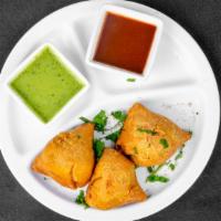 Samosa (3 Pieces) · Deep fried pastry stuffed with mildly spiced potatoes, green peas, and garden herbs.