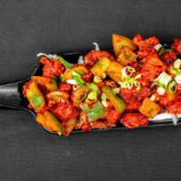 Chennai Chilly Chicken · Medium spicy. Chicken pieces sautéed with fresh green chilies and onions.