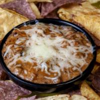 Kaya® Yucatan Black Bean Dip & Chips | 16Oz · Black beans fired up with chipotle peppers and Parmesan cheese. Topped with melted Jack.