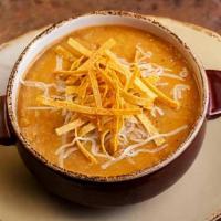 Tortilla Soup Bowl · Taking the edge off of our tortilla chips since 1993. Tomato and chile base with grilled chi...