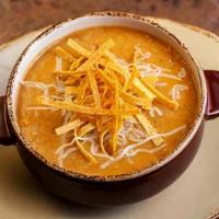 Tortilla Soup Cup · Taking the edge off of our tortilla chips since 1993. Tomato and chile base with grilled chi...