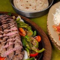Steak Fajita · Dijon-Worcestershire-marinated grilled steak. Served with Mexican rice, sour cream, guacamol...