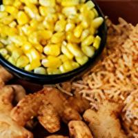 Kid'S Dino Nuggets · Golden chicken nuggets served with rice and buttered corn.