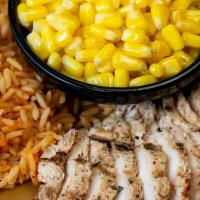 Kid'S Grilled Chicken · Grilled chicken, corn off-the-cob and Mexican rice.
