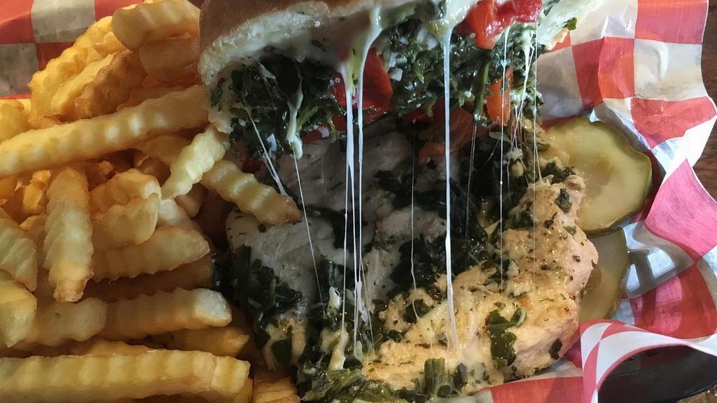 Chicken Inner Harbor Sandwich · Boneless breast sauteed in olive oil with garlic, roasted peppers, sauteed spinach, and smoked mozzarella.