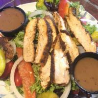 Grilled Chicken Sandwich · Served with lettuce, tomato, and onion.