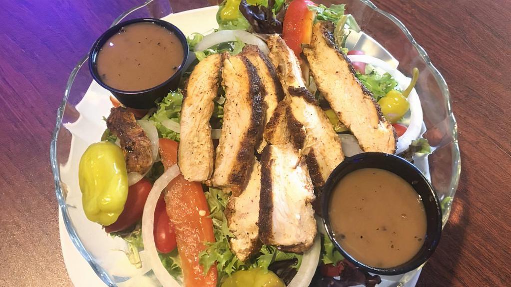 Grilled Chicken Sandwich · Served with lettuce, tomato, and onion.