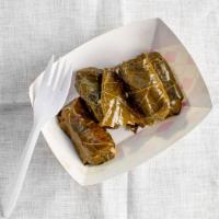 Stuffed Grape Leaves (6Pcs) · Brined grape leaves are lovingly stuffed with rice, tomato, onion and spices.