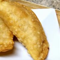 Empanadas · Two light pastries fried to a golden crisp, filled with your choice of picadillo (seasoned g...