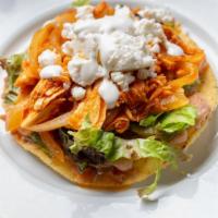 Tostadas · Two crispy fried tortillas topped refried beans, tomatillo salsa, lettuce. Cotija cheese, cr...