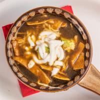 Sopa De Tortilla · Homemade chicken and tomato broth, crispy tortilla strips, avocado. Cheese, crema, chile pas...