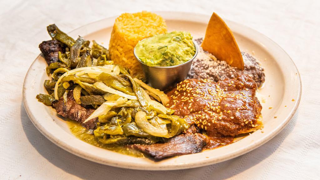 Carne Tampiqueña · 9 oz grilled skirt steak topped with poblano peppers, served with guacamole cheese mole enchilada, rice, beans and tortillas.