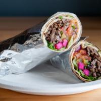 Beef Shawarma Roll Up · Marinated beef, fire roasted and thinly sliced served with lettuce, tomato, Pickles, onions,...