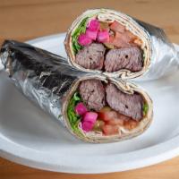 Steak Kebab Rollup · Marinated beef, skewered and charbroiled served with lettuce, tomato, pickles and Garlic aio...