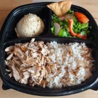 Chicken Shawarma Plate · Marinated all natural chicken breast fire roasted and thinly sliced served with three sides.