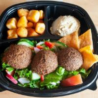 Falafel Plate · Ground chickpeas with herbs and spices lightly fried served with three sides.