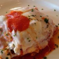 Lasagna · Lasagna with ground beef, parmesan, mozzarella, ricotta cheese, and fresh herbs with our han...