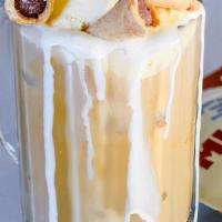 Bob Marley · shots of espresso in smooth steamed white chocolate milk with all natural banana and coconut...