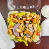 Garden Salad · Mixed lettuce, green pepper, tomato wedges, red onion, cucumbers, kalamata olives, and peppe...