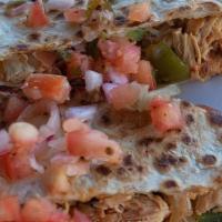 Chicken Quesadilla · Crispy flour tortilla stuffed with cheddar-jack cheese, pulled chicken, jalapenos, bell pepp...