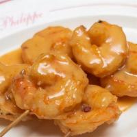 Satay Shrimp · Tender strips of meat with glazed coconut-based spices and barbequed on bamboo skewers. Serv...