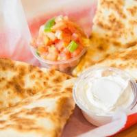 Grande Quesadilla · Grilled flour tortilla filled with cheese and your choice of extras