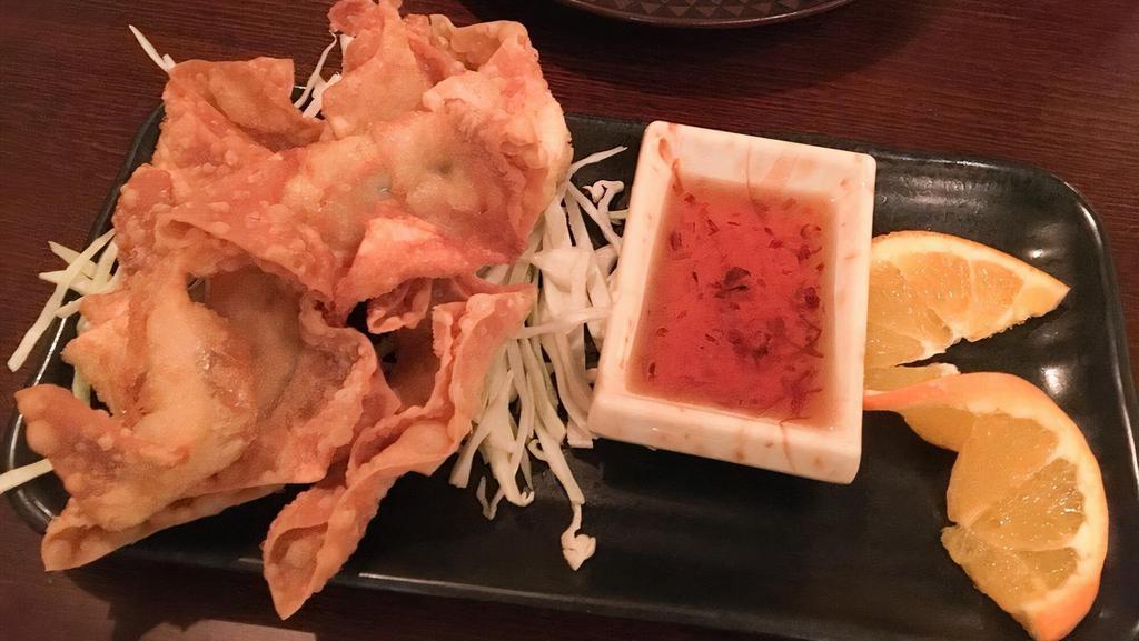 Crispy Angel · Chicken and shredded carrot wrapped in wonton skin. Served with a sweet chile dipping sauce.