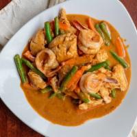 Sautéed Ginger Curry · Stir-fried combination of chicken and shrimp with ginger curry and Thai chile paste.