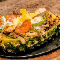 Hawaiian Fajitas · Shrimp, beef and grilled chicken cooked with green peppers, mushrooms, carrots, onions, zucc...