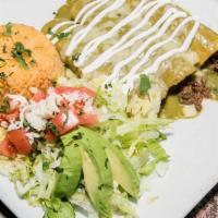 Enchiladas Suizas · Favorite. Three enchiladas filled with your choice of meat and topped with tomatillo sauce a...