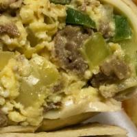 Philly Breakfast Wrap Breakfast Special · Scrambled eggs with thinly sliced steak, green peppers, onions, and American cheese inside a...