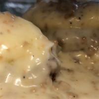 Burger Benny Breakfast Specialty · Biscuits topped with burger patty, poached eggs and sausage gravy.
