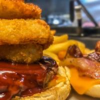 Cowboy Burger · Made with bacon, BBQ sauce, Cheddar cheese and onion rings on the burger.