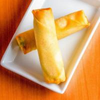 Spring Roll · Two pieces. Rice paper or crispy dough filled with shredded vegetables.