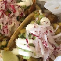 Taco · One fresh handmade corn tortilla with choice of one filling, onions, cilantro, and radish.