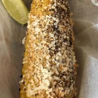 Elote · Grilled corn with cheese and mayonnaise.