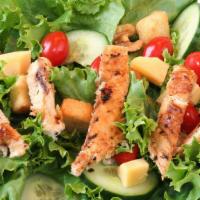 Grilled Chicken Salad · Our signature salad! Chicken marinated in olive oil and select herbs and spices, grilled to ...