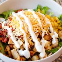 Chipotle Bowl · Your choice of chicken or beef. Served with black beans, corn, lettuce, pico de gallo, chedd...