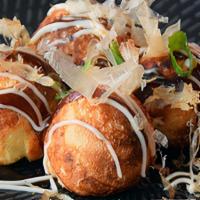 Takoyaki (6 Pieces) · Crispy fried octopus ball with bonito flakes, mayonnaise and katsu sauce.