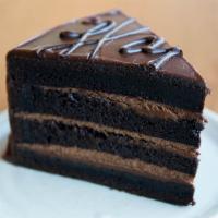 Dark Chocolate Cake · Rich, decadent, dark chocolate cake with chocolate mousse, ganache, cocoa nibs

contains:
-d...