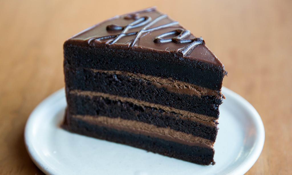 Dark Chocolate Cake · Rich, decadent, dark chocolate cake with chocolate mousse, ganache, cocoa nibs

contains:
-dairy
-gluten
-soy

NO nuts