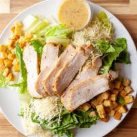 Chicken Caesar Salad · Chopped romaine topped with, garlic crouton, lemon thyme rosemary chicken breast, shredded p...