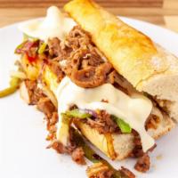 Steak And Cheese · 6 inch french baguette filled with seasoned shaved beef, grilled onions and peppers and melt...