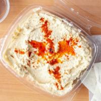 Hummus · Slow cooked organic chickpeas mixed with tahini, salt and lemon juice, garnished with olive ...