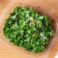 Tabouli · Fresh parsley mixed with tomato, bulgur, mint, onions, lemon juice and olive oil.