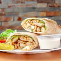 Chicken Shawarma · Marinated chicken strips with garlic paste, French fries and pickles.